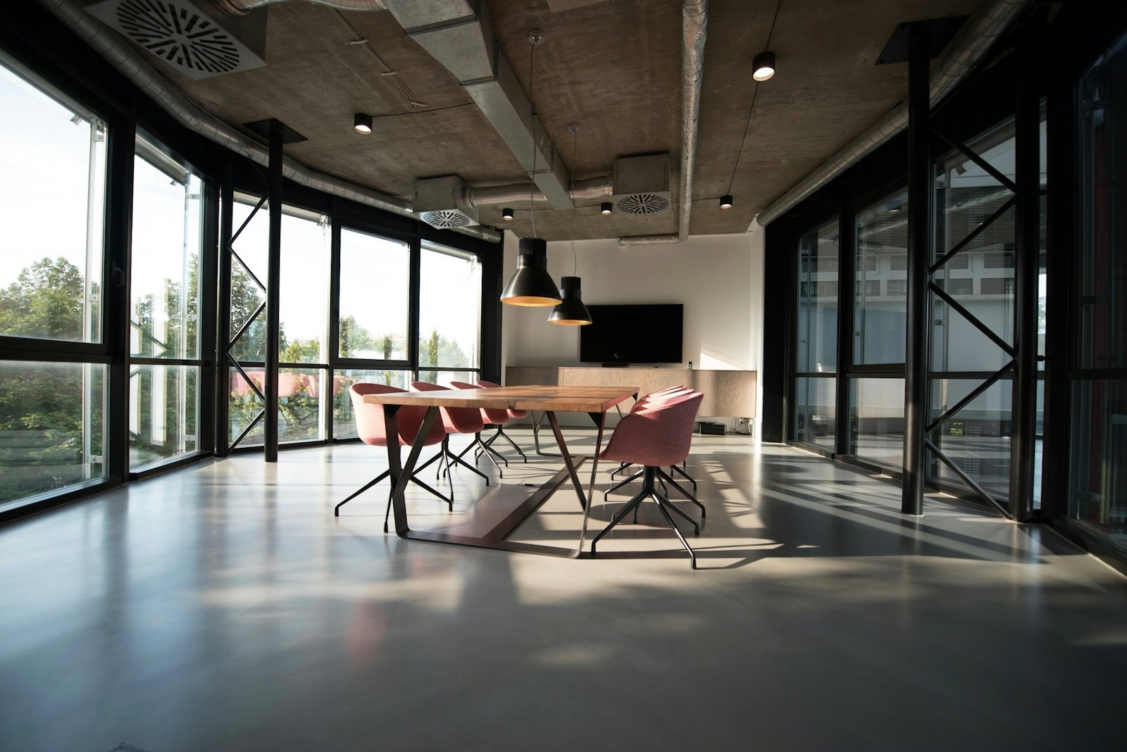 A clean, sunlit office meeting space